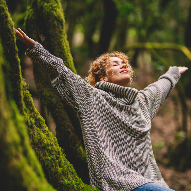 Happy woman into the woods